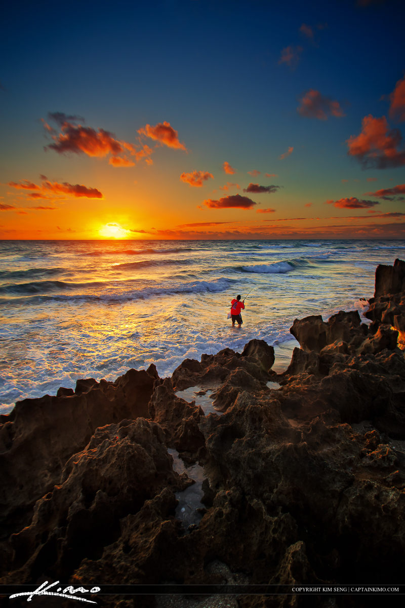 Fisherman fishing in Ocean at Hutchinson Island Beach Stuart Florida